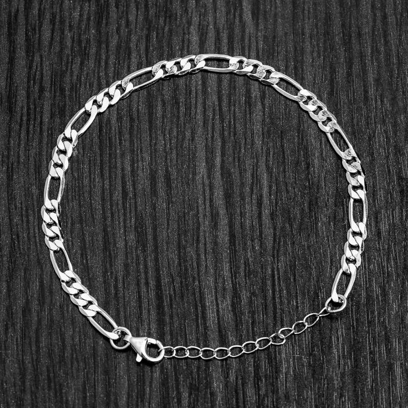 Our Silver Figaro Chain Bracelet features our premium silver figaro chain and signature polished silver plate, engraved with RG&B.